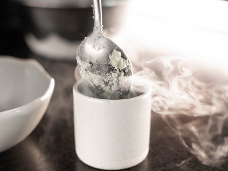 Useful info for your hotel in South Tyrol Spoon over a white cup with steam rising